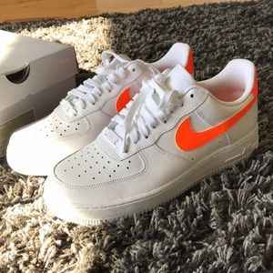 White and orange Nike Air Force 1’s. Never worn